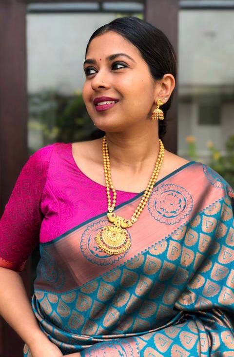 Gleaming Banarasi Soft Silk Saree with Zari Work & Matching Designer Blouse Piece
