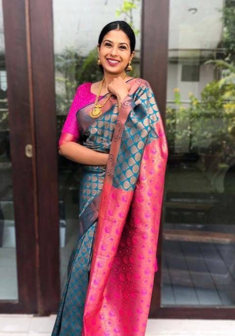 Gleaming Banarasi Soft Silk Saree with Zari Work & Matching Designer Blouse Piece